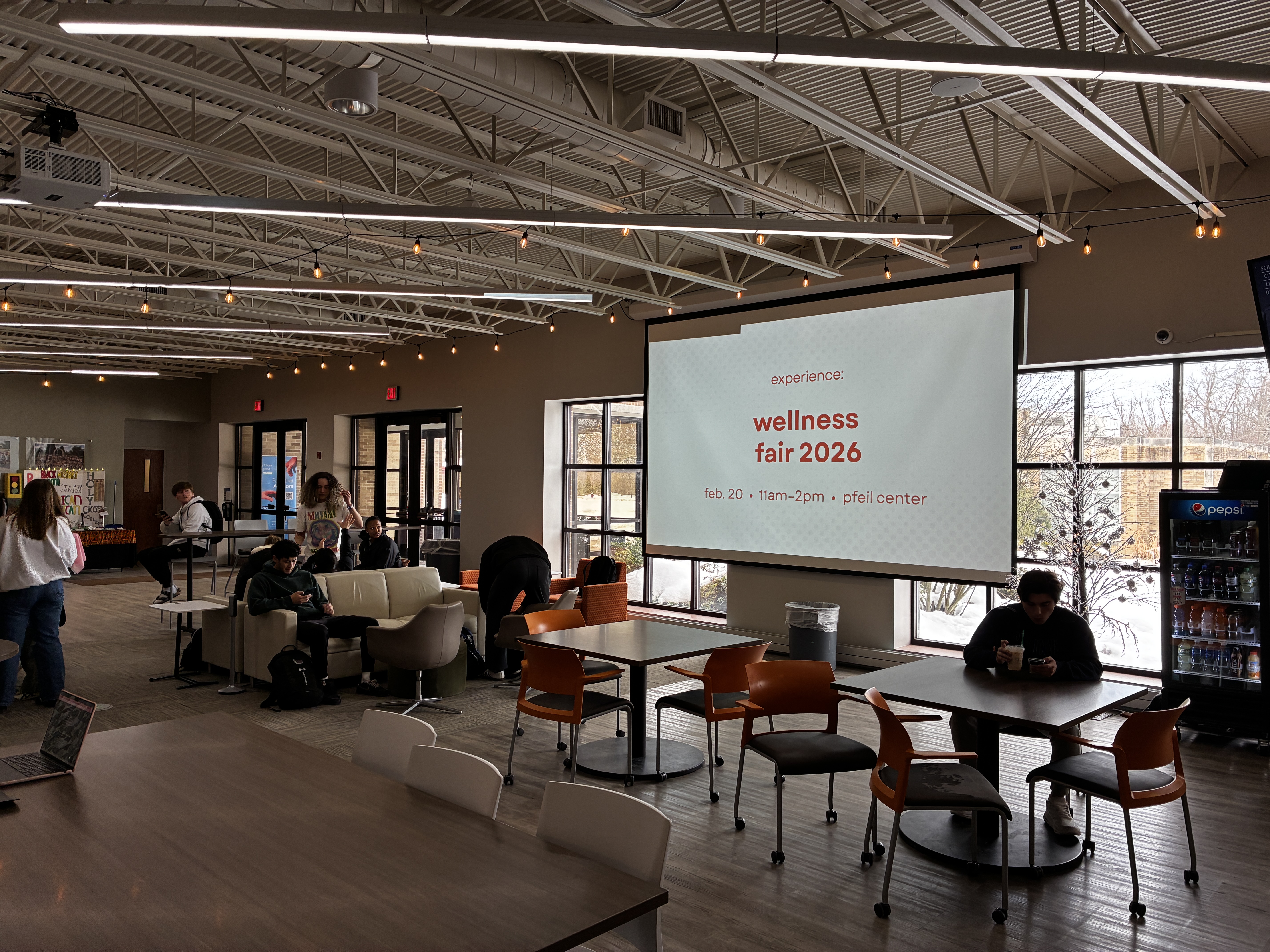 The Wellness Fair slideshow running on the projector in Ave Brew